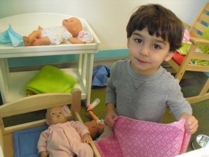 Taking care of the babies in the Dramatic Play center